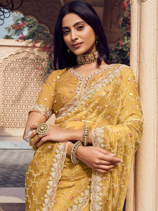 Bollywood Inspired Mustard Yellow Embroidered Net Saree with Intricate Border