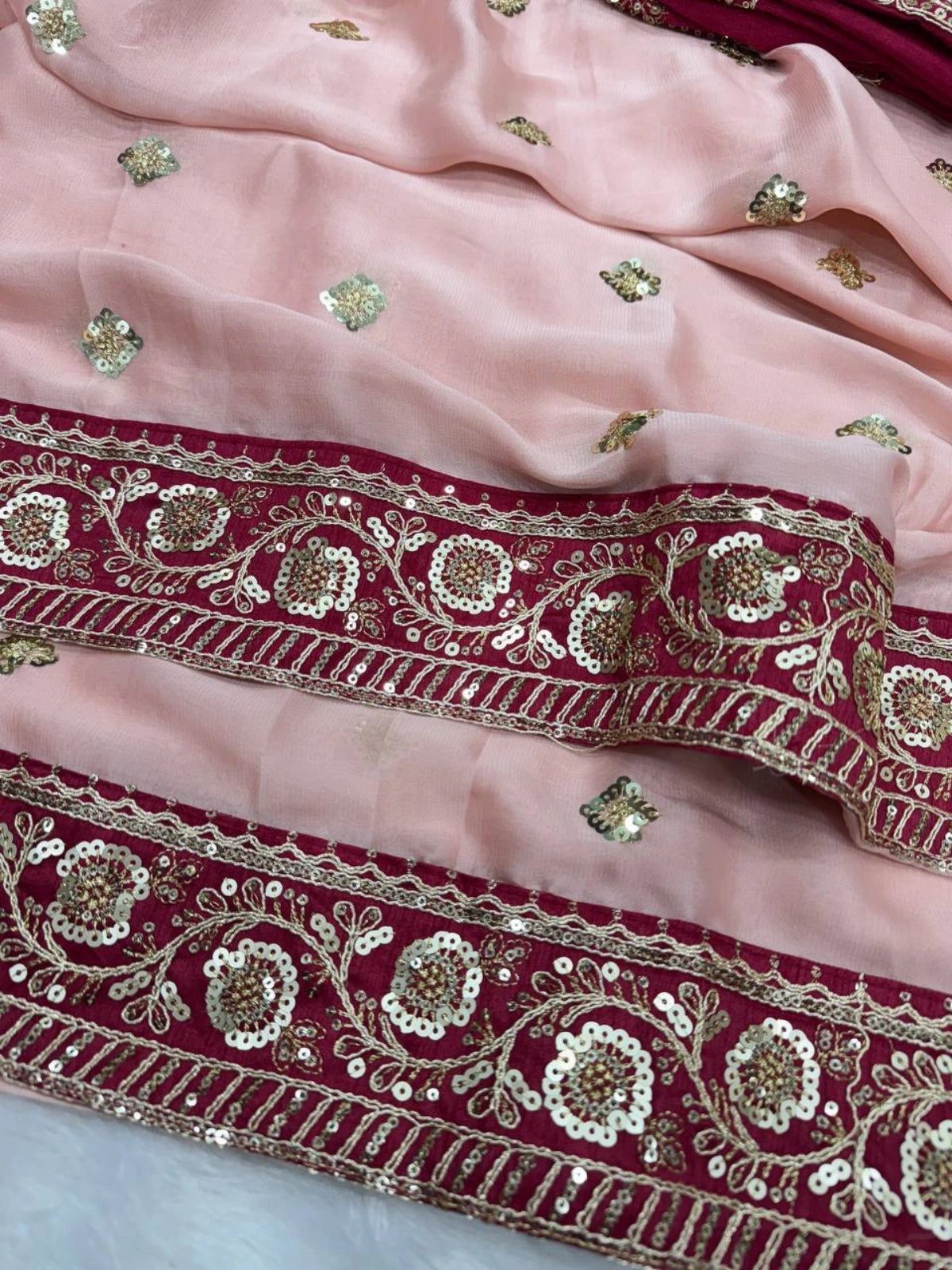 Soft Pink Saree with Delicate Golden Motifs and Embroidered Maroon Border-67269294096465